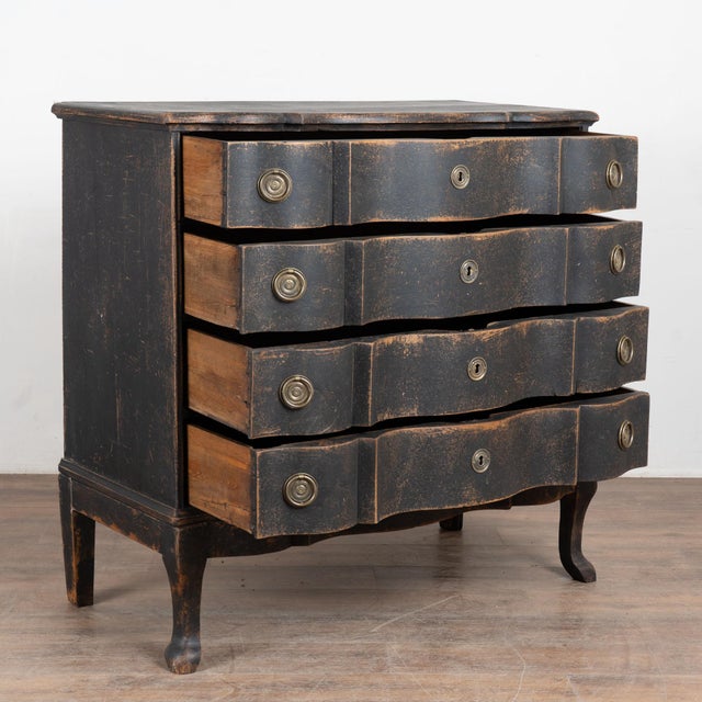 Late 18th century large Danish chest of four drawers, crafted in oak with a black painted finish. The four generously...