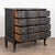 Late 18th century large Danish chest of four drawers, crafted in oak with a black painted finish. The four generously...