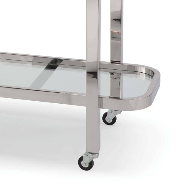 Art deco-inspired with a modern appeal, this bar cart offers a timelessly chic and functional component to any space. Wipe...