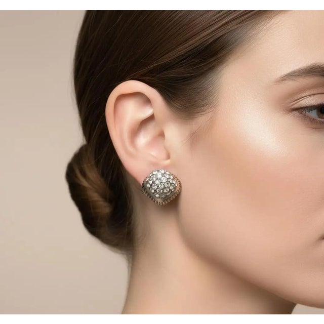Add a touch of authentic mid-century Italian glamour to your collection with these stunning 1950s "toppe" clip-on...
