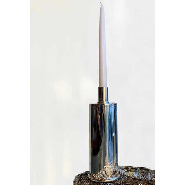 Rl 02 maxi candleholder in silver-plated polished brass by caspal dimensions: ø 8 x h 24,5 cm. Materials: silver-plated...
