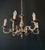 Luxurious antique chandelier. italy, 20th century. the chandelier is made of bronze. Decorated with brass elements....