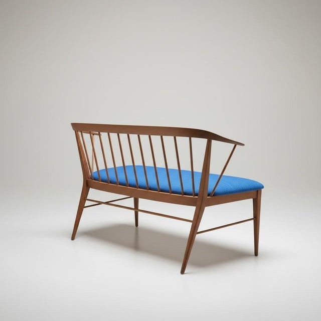 This is a pair of Danish modern carved teak settees. They have been newly upholstered. They date to the 1960s. Each has a...