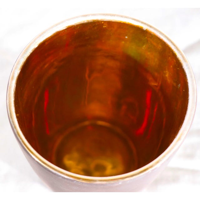 Sophisticated Art Deco, Mid Century ceramic, porcelain vase having a mat finish exterior in brown, with a bright mirror...