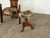 This stool is constructed in solid oak with a turned central column rising from three curved, arc-shaped feet. The feet...