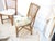 This pair of bamboo chairs have faded, distressed seat cushions which can be re-covered.