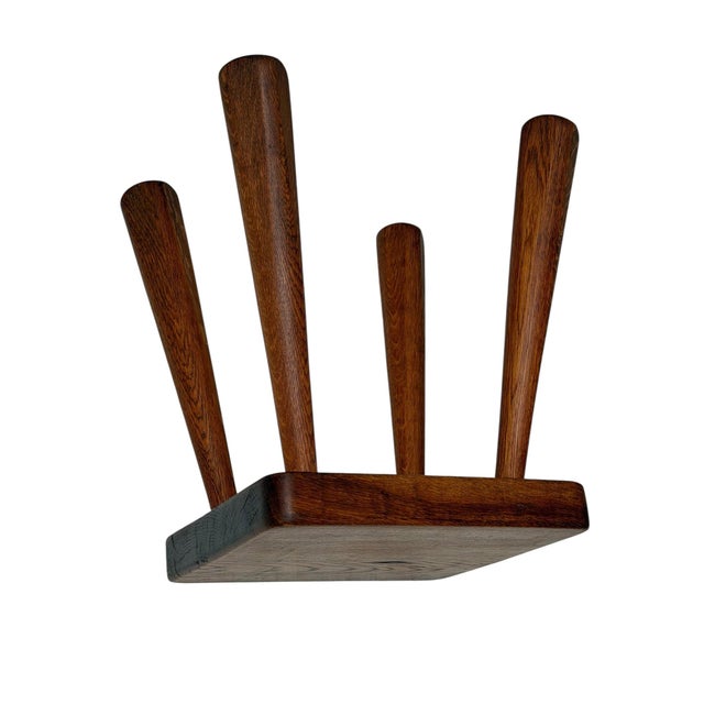 Stunning and elegant Brutalist stool. Striking Dutch design from the 1960s. Thick solid oak top on four splayed legs. This...