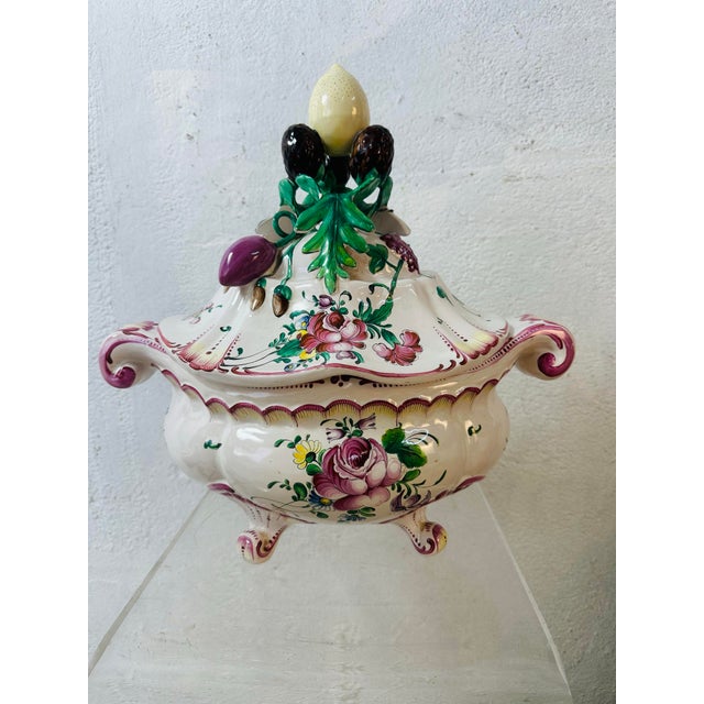 This is an ornate antique-style porcelain covered tureen (or decorative lidded vessel) in a Rococo-inspired form. It...