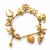 An authentic and charming vintage keepsake bracelet crafted in solid 10k yellow gold. Featuring a classic link bracelet...