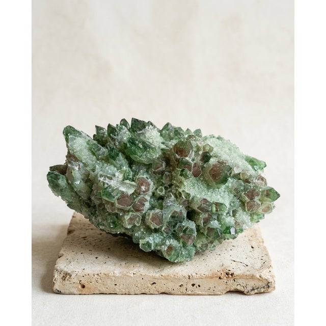 A sculptural natural Green Phantom quartz cluster selected for its deep chlorite inclusions, subtle hematoid undertones,...