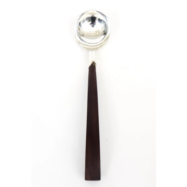 This beautiful mid century modern 1940's hallmarked sterling silver and rosewood long sculptural serving spoon is very...