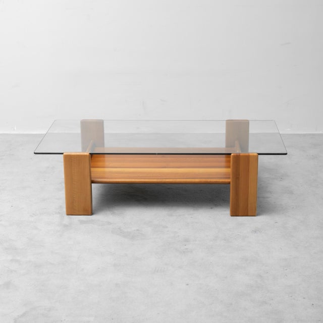Coffee table. Wooden frame and glass top. Good condition, shows signs of wear. See photos.