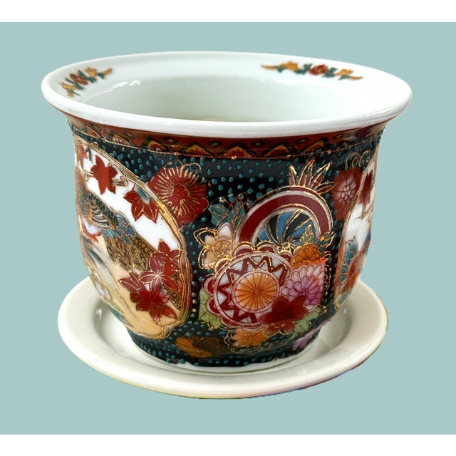 Mid-Century Chinese porcelain planter with saucer, featuring intricate traditional Asian patterns. Raised moriage detail...