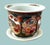 Mid-Century Chinese porcelain planter with saucer, featuring intricate traditional Asian patterns. Raised moriage detail...