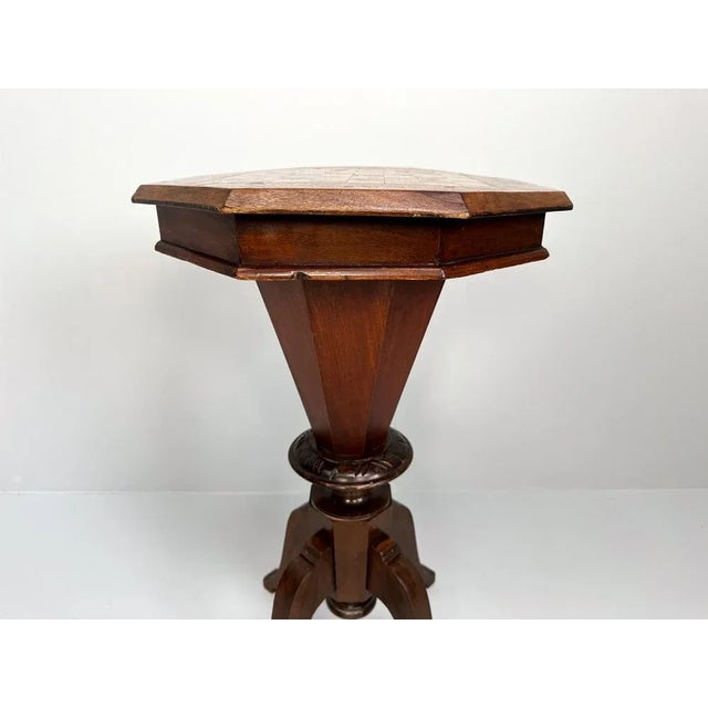 This exquisite mid-19th century Victorian sewing table, dating to around 1860, features a distinctive cylindrical or...
