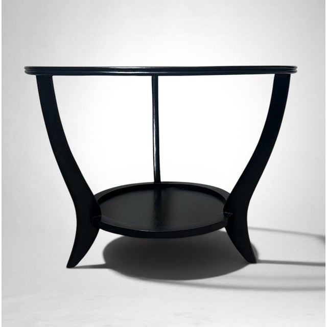 Elegant and distinctive Italian Art Deco side table crafted from walnut wood and finished in a rich black ebonized...