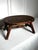 A storied patina of aged wood and paint splatters are exhibited on this low oval stool. Consisting of solid wood in a...