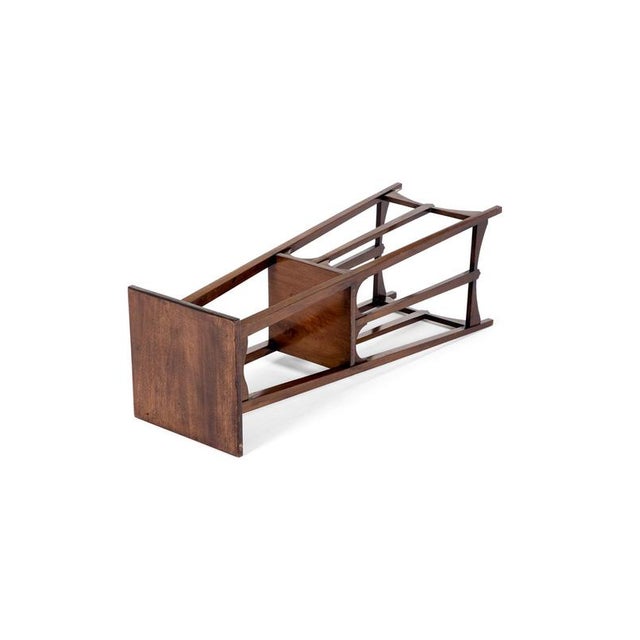 An early 20th century arts and crafts jardiniere stand of square form in mahogany by london retailer liberty & co. The top...