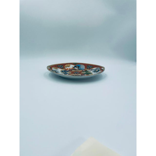 This plateau was produced in Japan between the 1930s and 1950s in the opulent Satsuma, Kutania style, and is made of high-...
