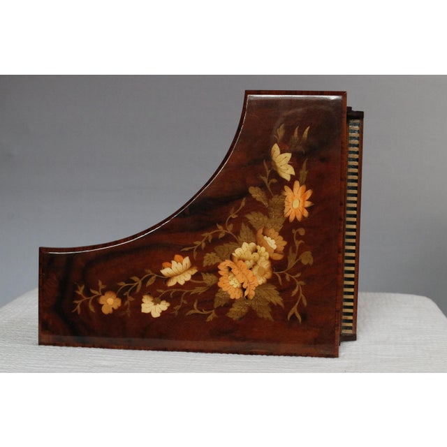 Crafted in the Sorrento Inlaid Wood Works studio of G. Fruscio in the 1950s. The box plays "Torna a Surriento," also known...