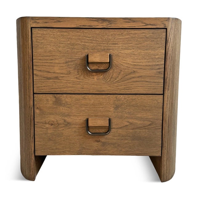 Modern farmhouse style rounded oak veneer nightstand with two drawers. Tawny brown finish and black iron ring drawer...