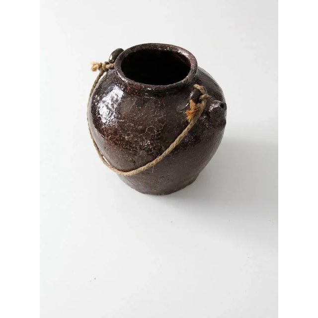 This exceptional antique clay bean pot features a rich brown Albany slip glaze with beautiful natural patina from age and...