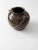 This exceptional antique clay bean pot features a rich brown Albany slip glaze with beautiful natural patina from age and...