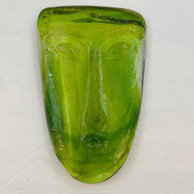 Hand blown green glass abstract face sculpture made in Sweden by Kosta Boda and designed by Erik H. Glund. Made in the...