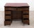 A gorgeous georgian style knee hole desk in mahogany top is finished in red leather with gilt embossed and this has just...