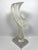 A large modern carved acrylic sculpture on an aluminum base. The sculpture captures the look of carved ice, with smooth...