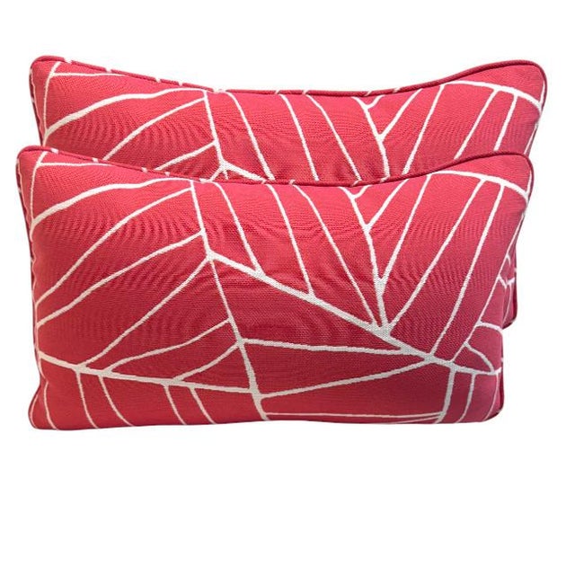 Elevate your space with this vibrant set of lumbar pillows featuring a bold color background and a modern, abstract white...