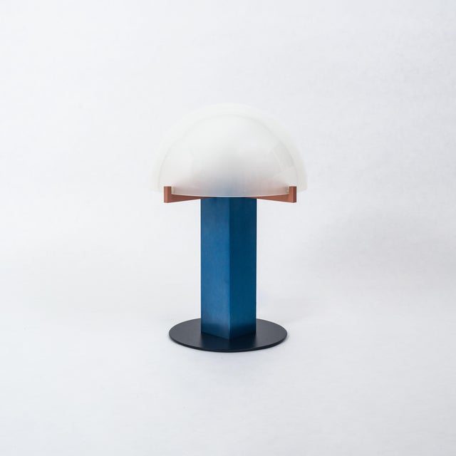 A Modern table lamp by Ron Rezek, circa 1980s. Also known as the "Mushroom Lamp." This lamp features blue and red anodized...