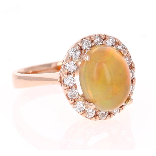 Beautiful and Cute! Who would have thought something so simple can be so sweet! This Opal and Diamond Ring is made in a...