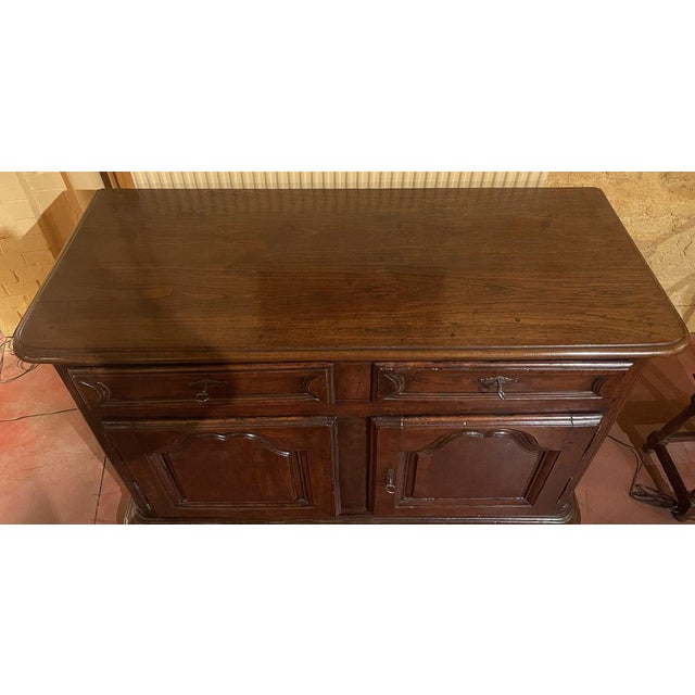 Superb Louis XIV walnut sideboard from the beginning of the 18th century from France Very elegant credenza or buffet which...