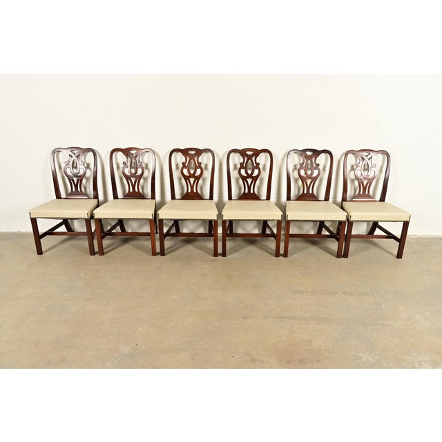 An outstanding set of six Georgian or Chippendale style dining chairs By Baker Furniture USA, Circa 1980s Carved solid...