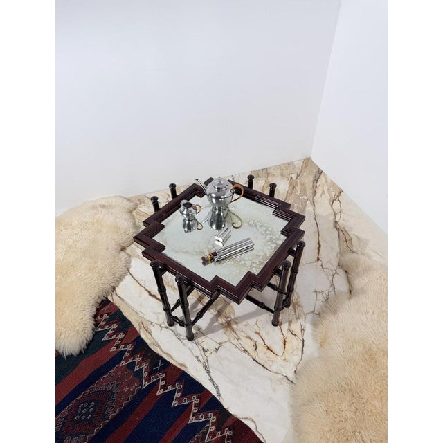 We are pleased to offer this distinctive 1970s coffee table celebrating the classic Chinese Chippendale style, with its...