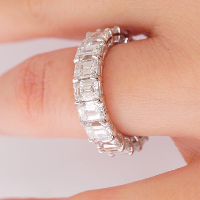 Diamond Wedding Eternity Band set in Platinum, featuring 20 beautifully matched Emerald cut diamonds with shared prongs....