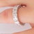 Diamond Wedding Eternity Band set in Platinum, featuring 20 beautifully matched Emerald cut diamonds with shared prongs....