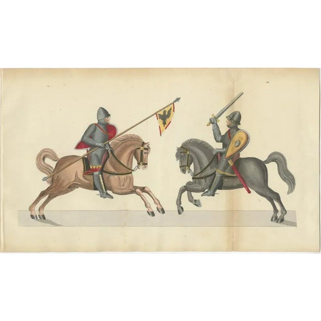 19th-Century Hand-Coloured Print of Armed Horsemen Bearing a Heraldic Banner This original hand-coloured lithograph,...
