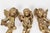 Gorgeous set of three mid-century French gold leaf gilded cherubs, each featuring detailed wings and flowing drapery, and...