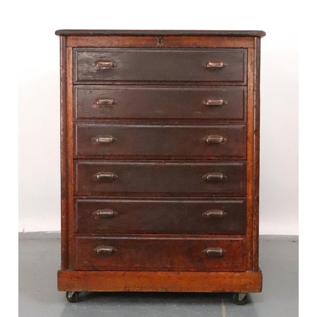 Antique Industrial style storage cabinet made of quarter sawn oak with a dark stain. This features six drawers, three of...