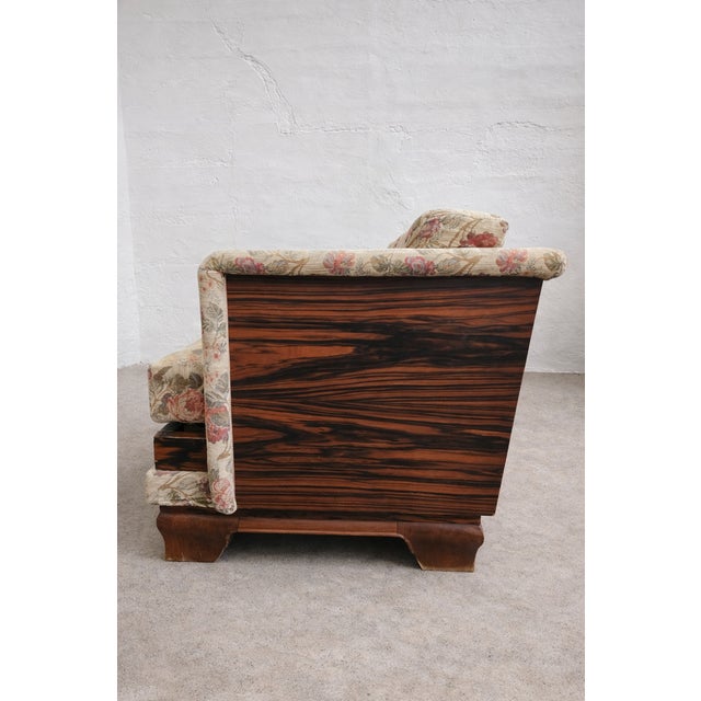 This exceptional Austrian Art Deco three-seater sofa from the 1930s is finished with striking Macassar veneer not only on...