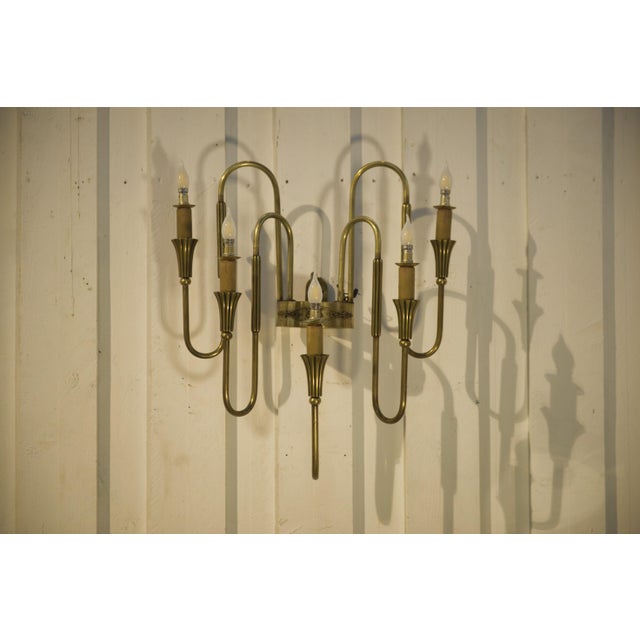 Monumental bronze (or gilt brass) wall sconce with five arms, featuring a highly architectural design. The arms are made...