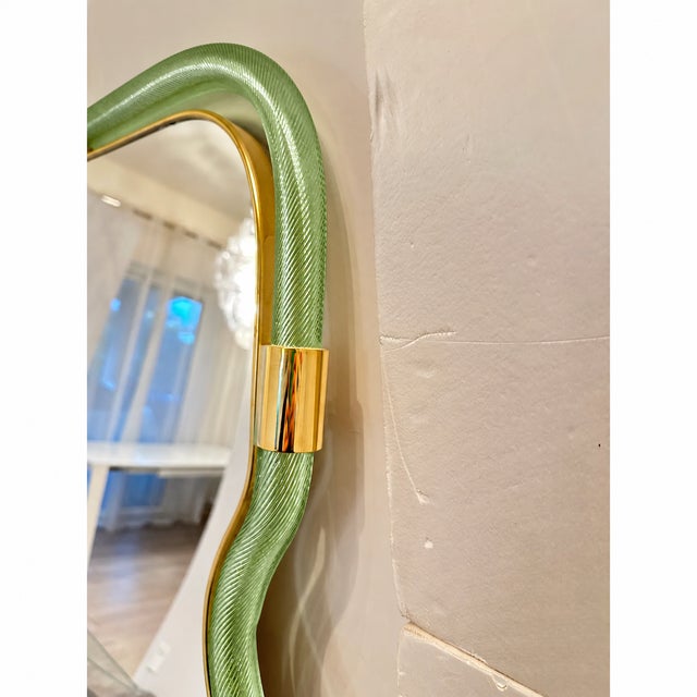 Impressive and scenographic Wave Mirror in trasparent and green “Torchon” Torciglione Murano Glass. Exclusive contemporary...