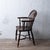 An English elm and ash windsor chair with crinoline stretcher, 19th century. 22 ½ inches wide by 21 inches deep by 36 ½...