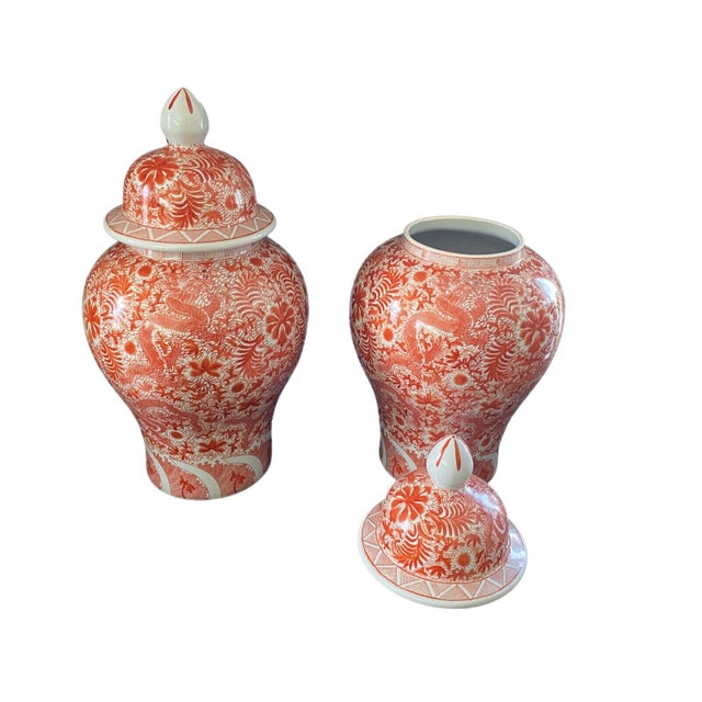 Superb 25" H by 13" Diameter Temple ginger jars, hand-painted with stunning dancing dragon motifs in vibrant coral over a...