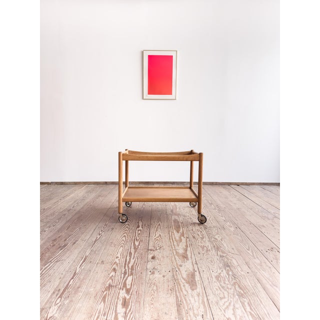 Dimensions: approx. 75 × 45 × 60 cm (width × depth × height) Elegant serving trolley, designed in 1959 by Hans J. Wegner...