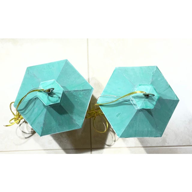 pair of vintage solid brass hanging lanterns, perfect for adding a touch of timeless elegance to any space. These...