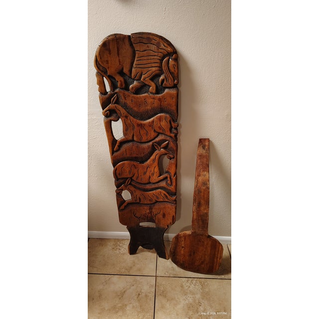 African Chief hand carved chair, comprised of two pieces that fit into each other for easy assembly. The back panel is...