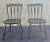 A pair of 19th Century Early American Ebonized and hand painted and decorated side chairs with great patina. Measure 19"...